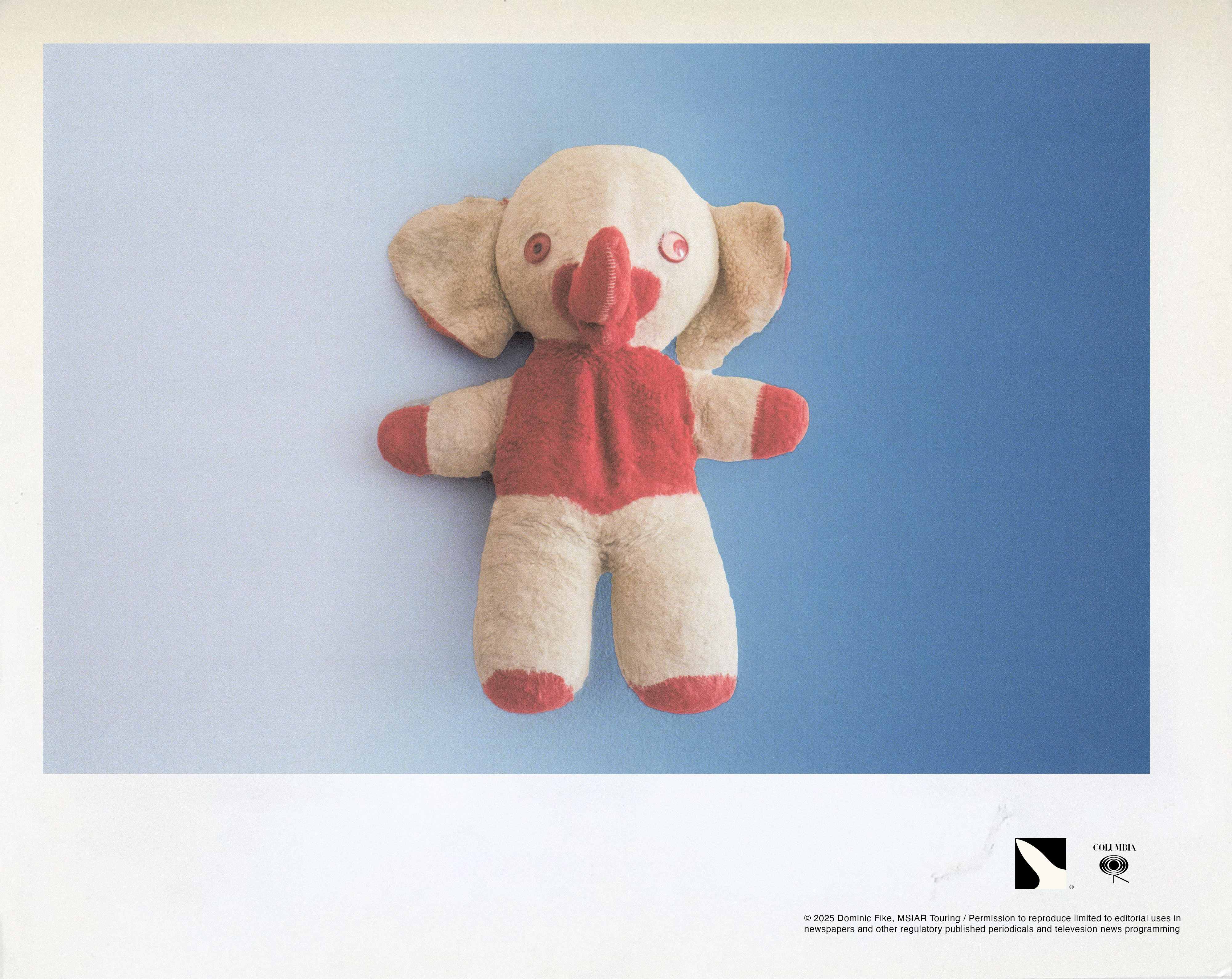 A stuffed animal toy on a poster